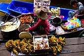 Thailand, Locals sell fruits, food and products at Damnoen Saduak floating market near Bangkok 